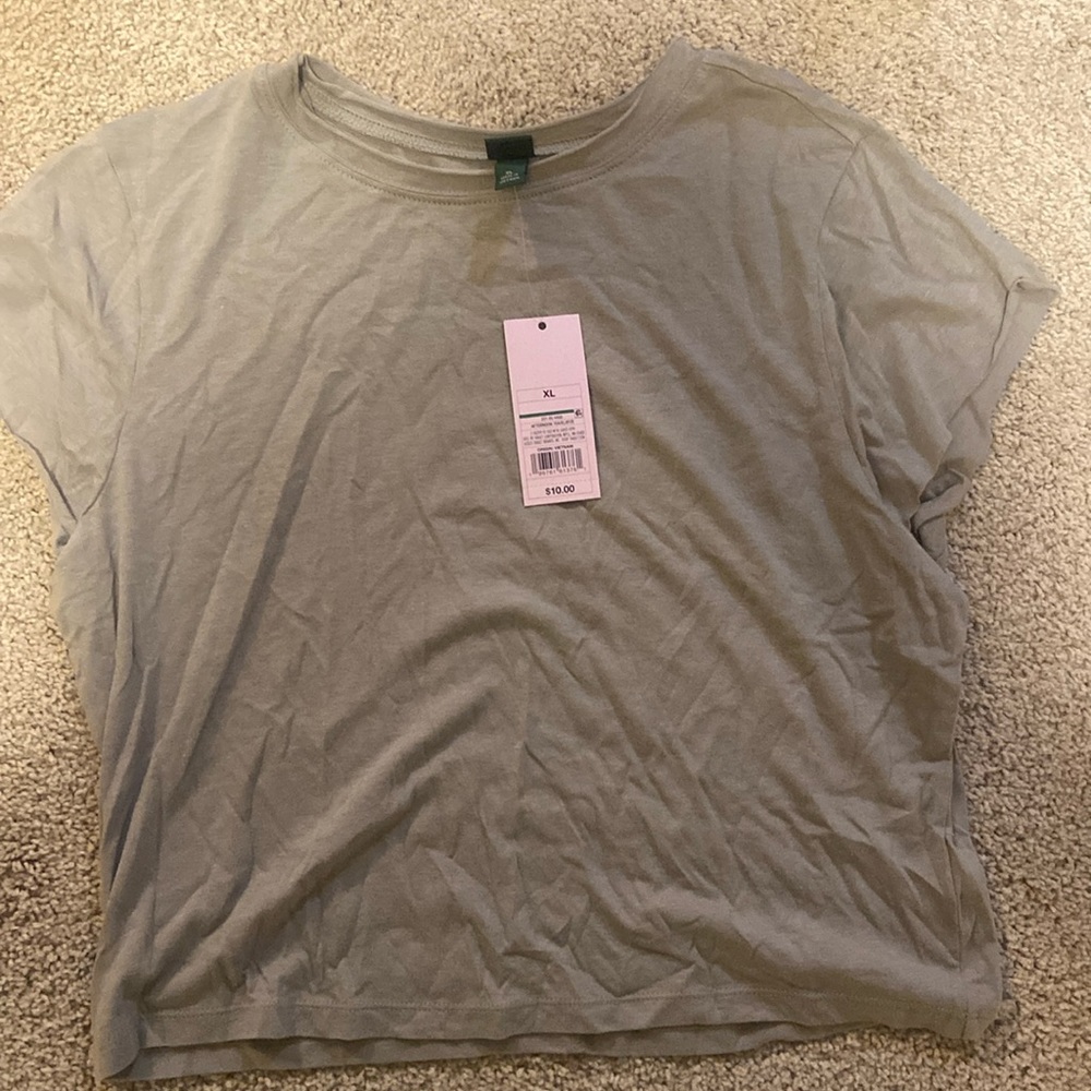 Baby tee shirt NEVER WORN. STILL WIGH TAGS.